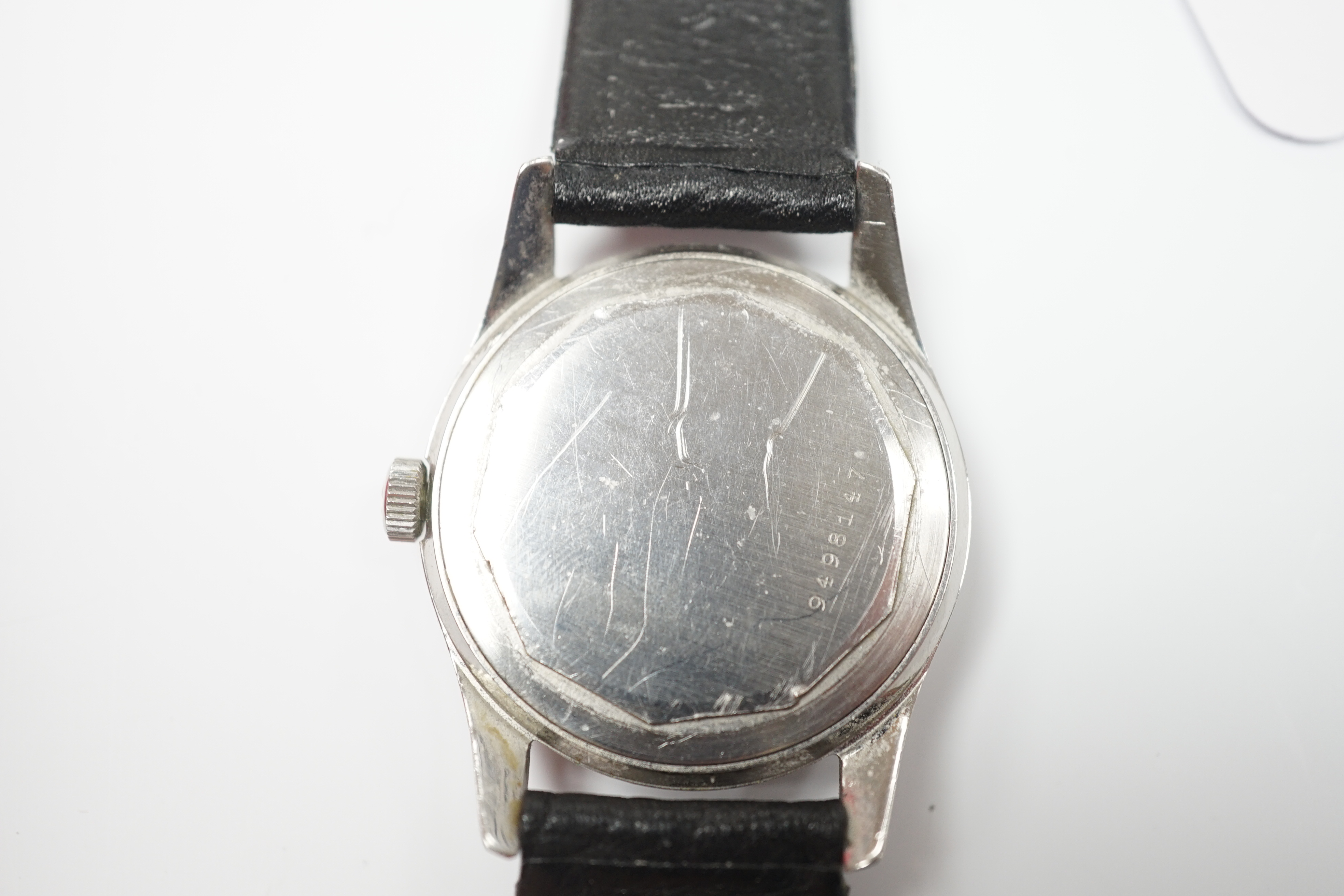 A gentleman's stainless steel Zenith manual wind wrist watch, retailed by Camerer Cuss & Co, London, on associated leather strap.